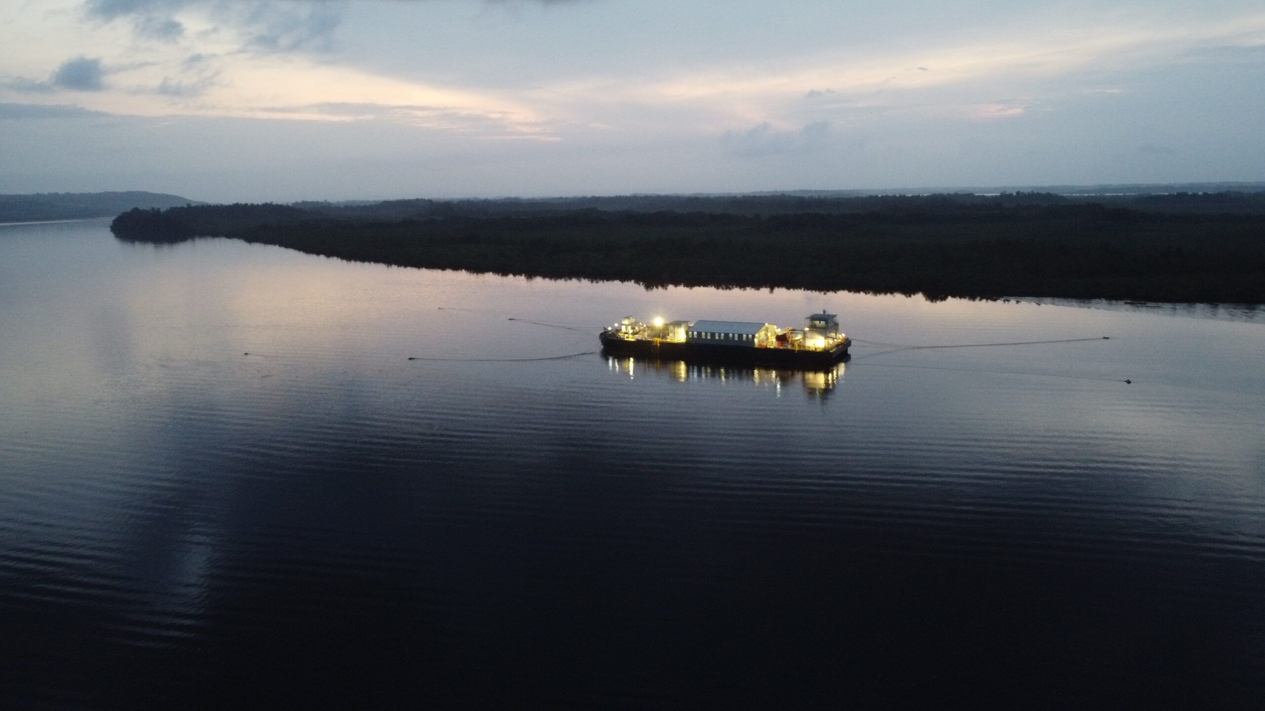 Barge platform floating along the coast