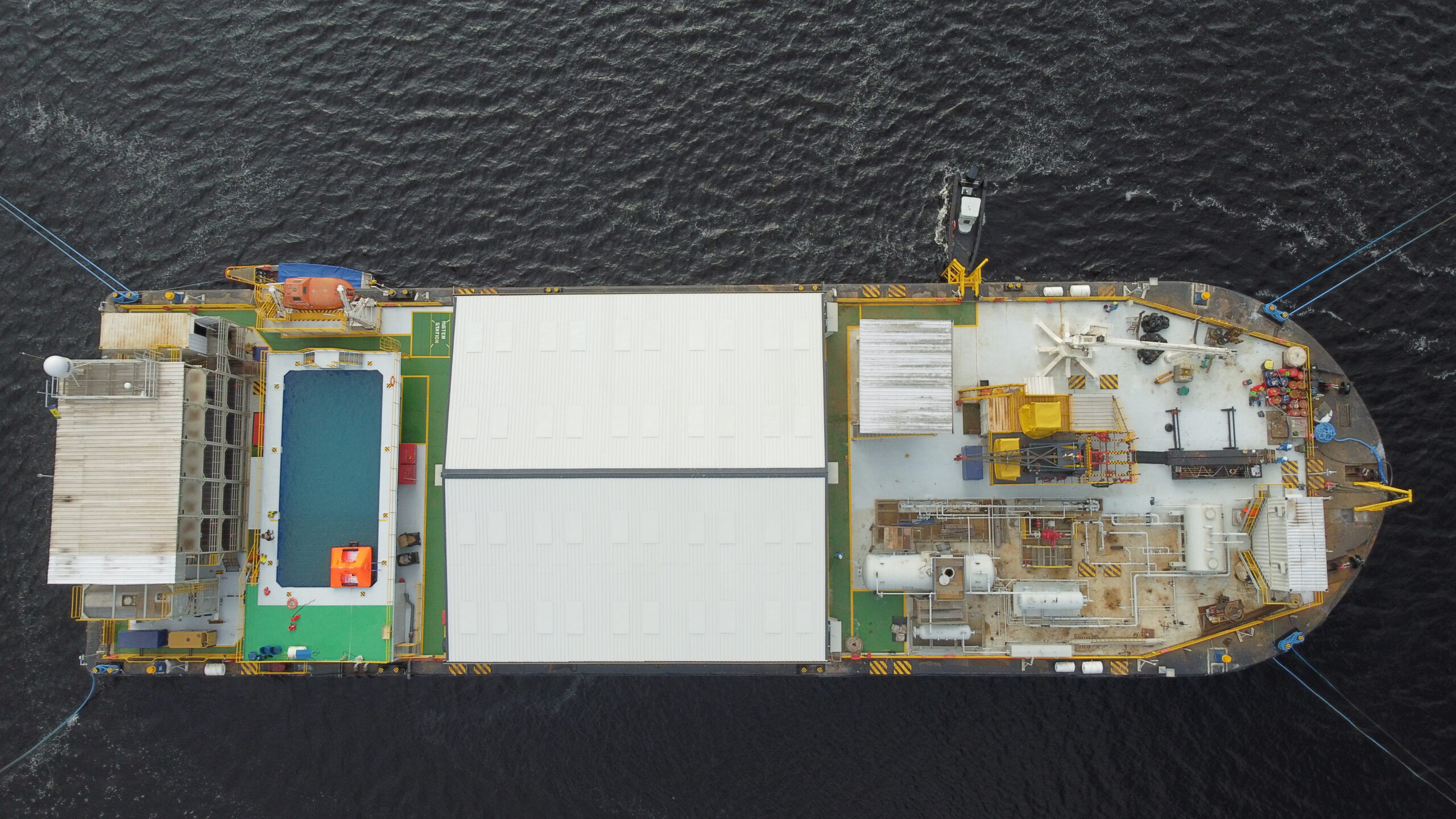 Long boat navigating seen from above