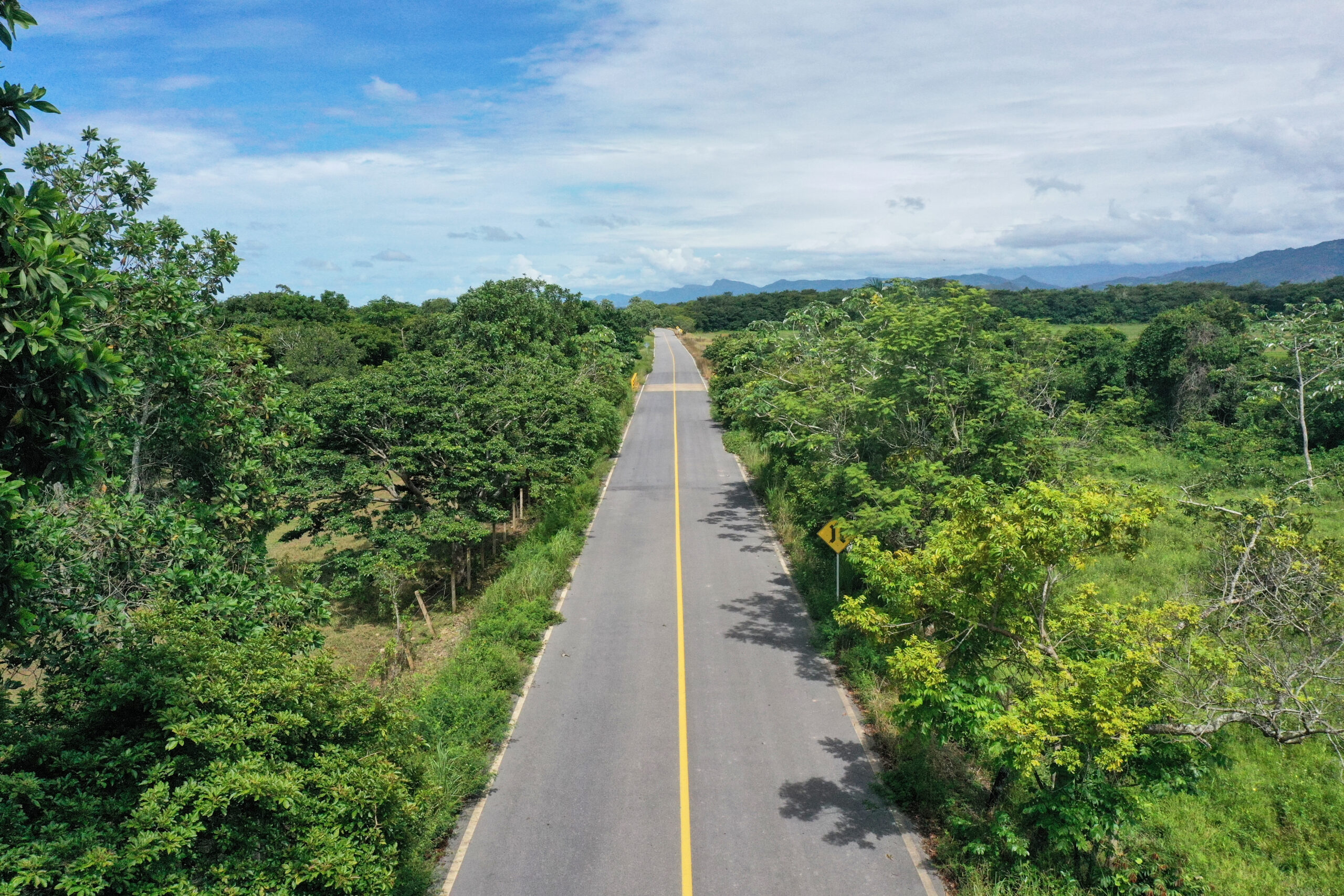 Straight road in the middle of Colombia forest