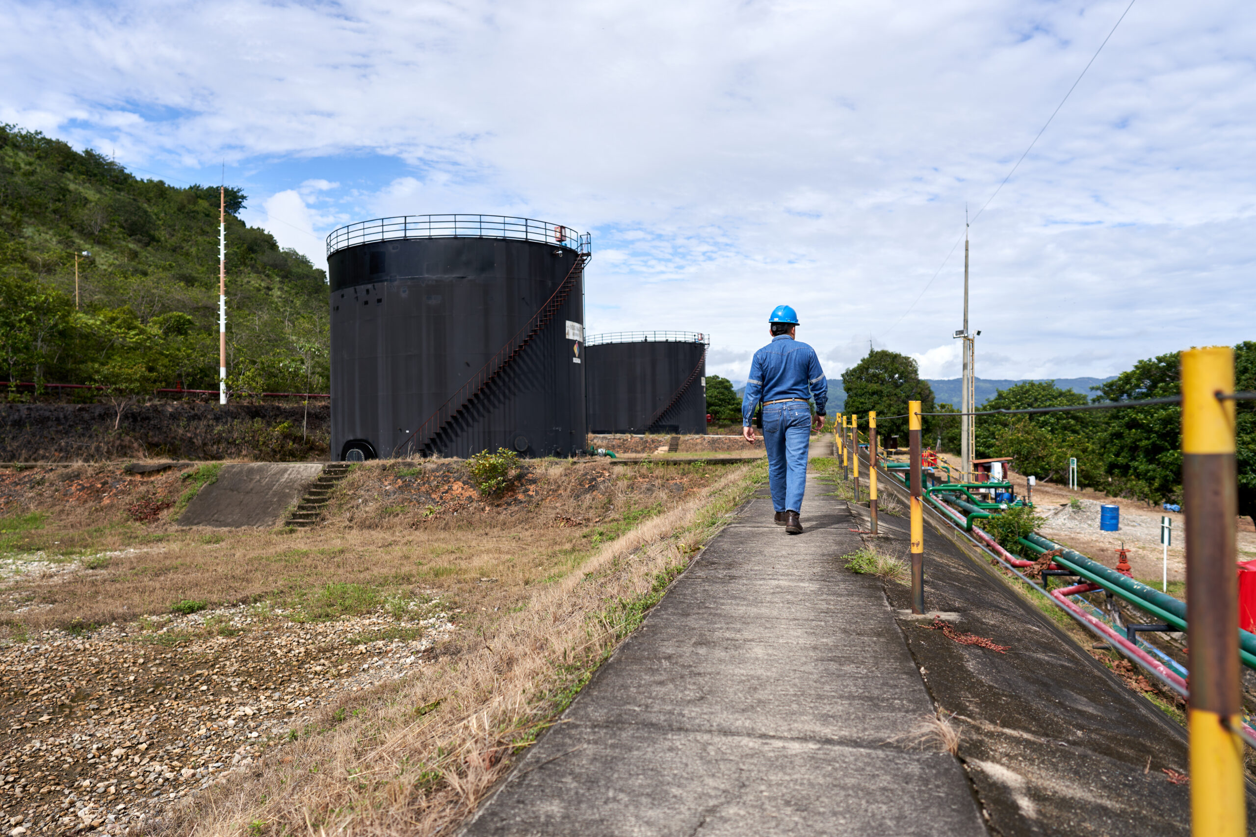 Working man walking in Araguaney farm onshore Colombia