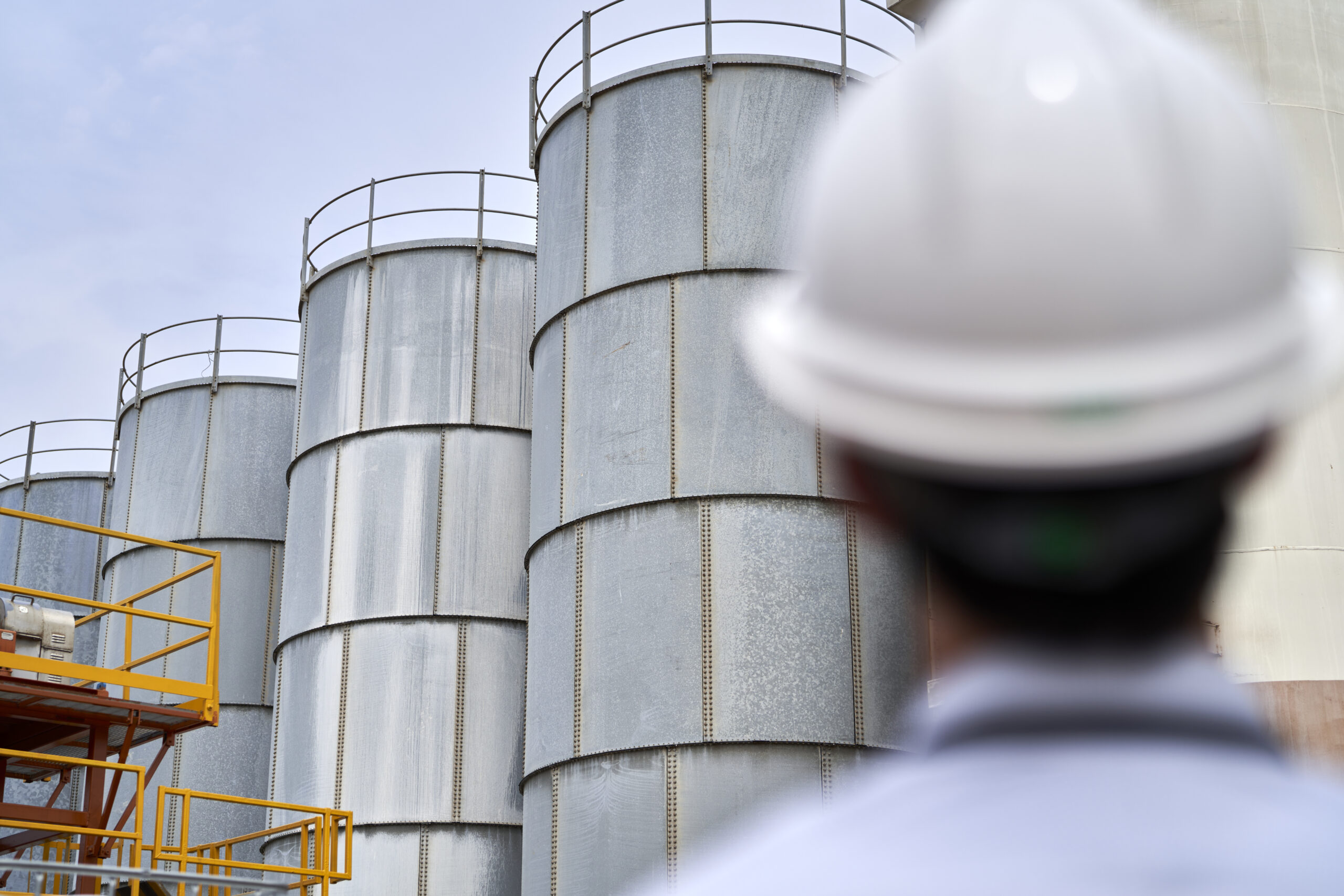 Bunch of working men looking up with hands in the air in Congo.