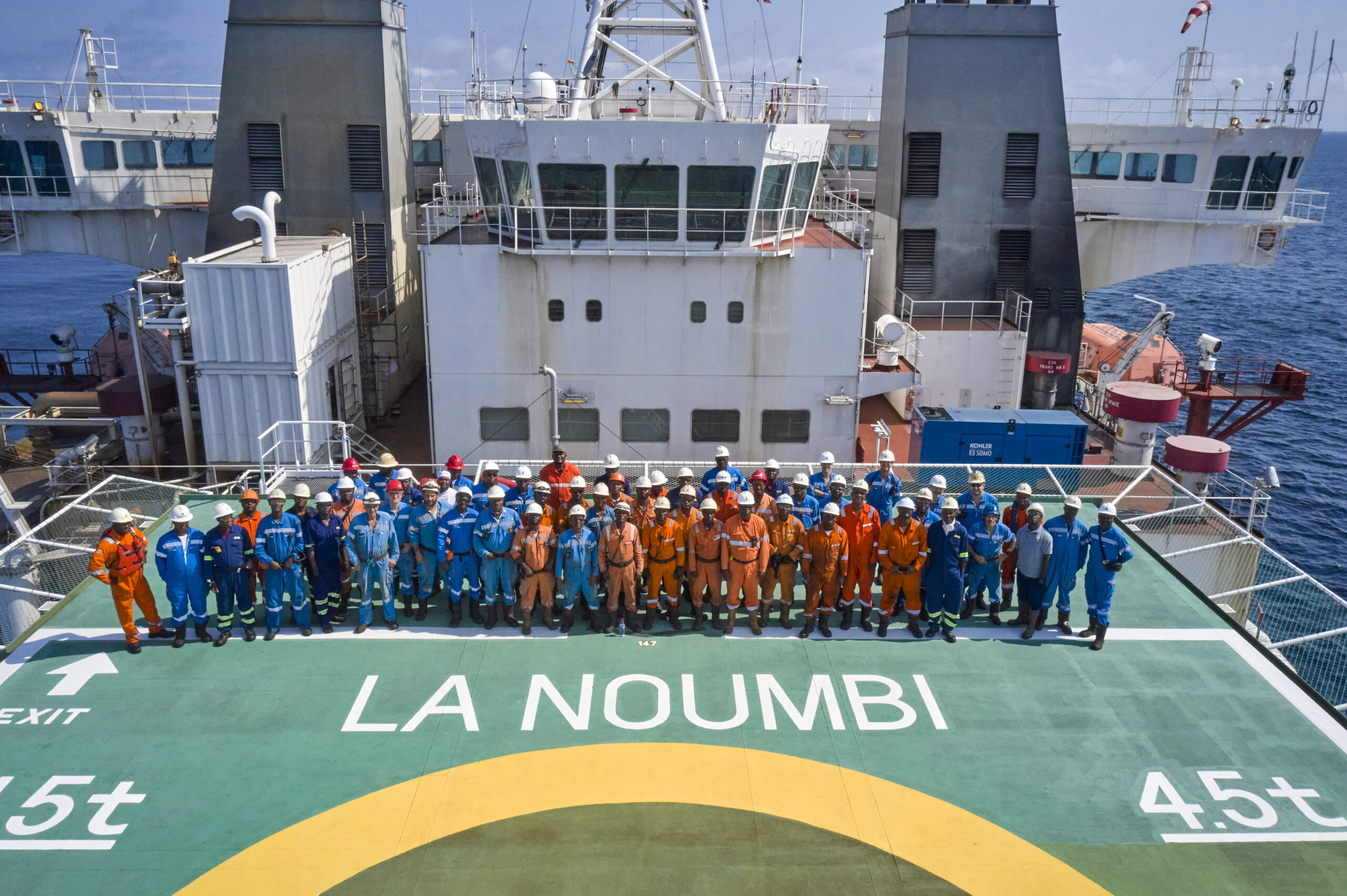 Bunch of working men lined up looking up on La Noumbi boat in Congo 