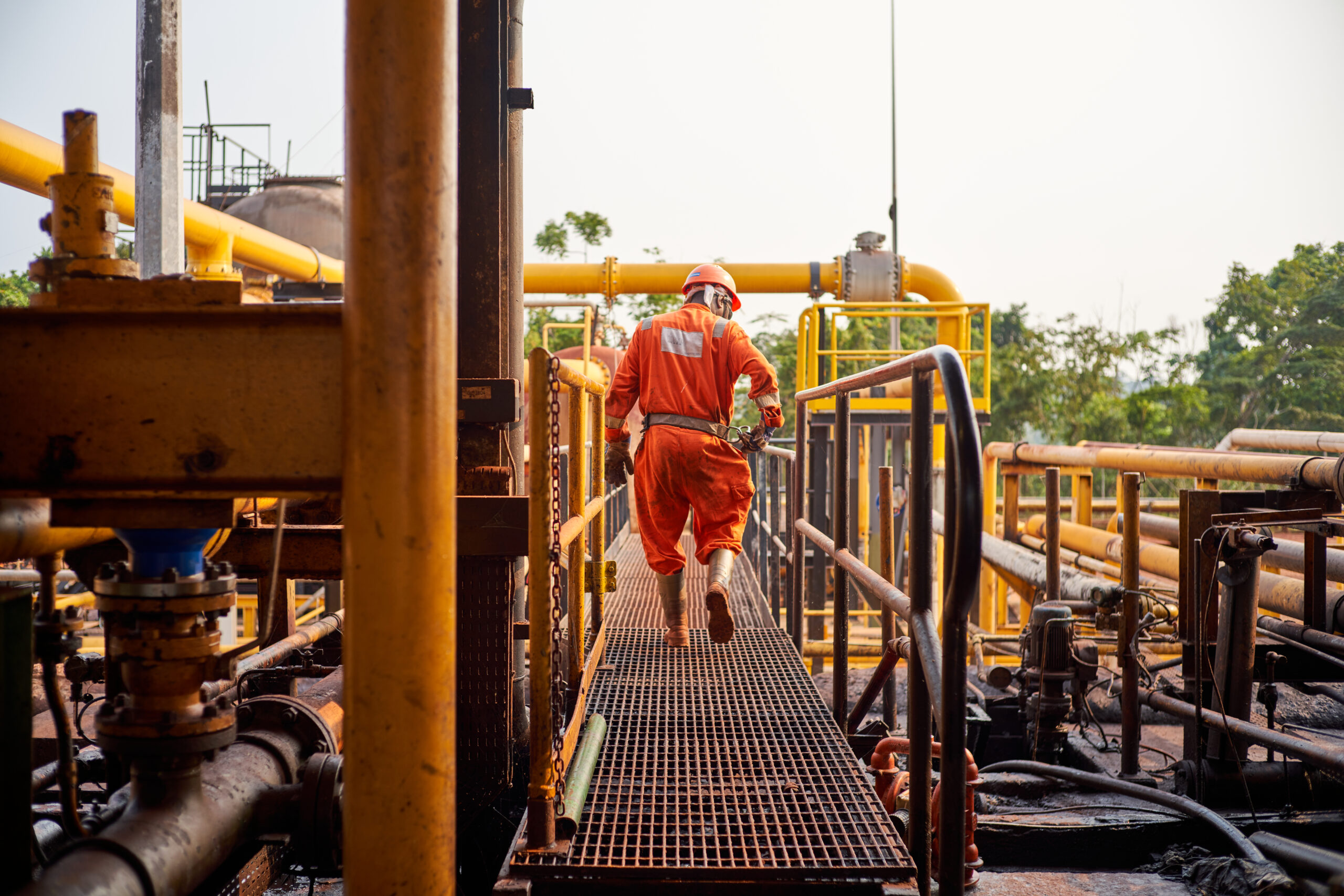 Worker walking on the bridge station in Gabon