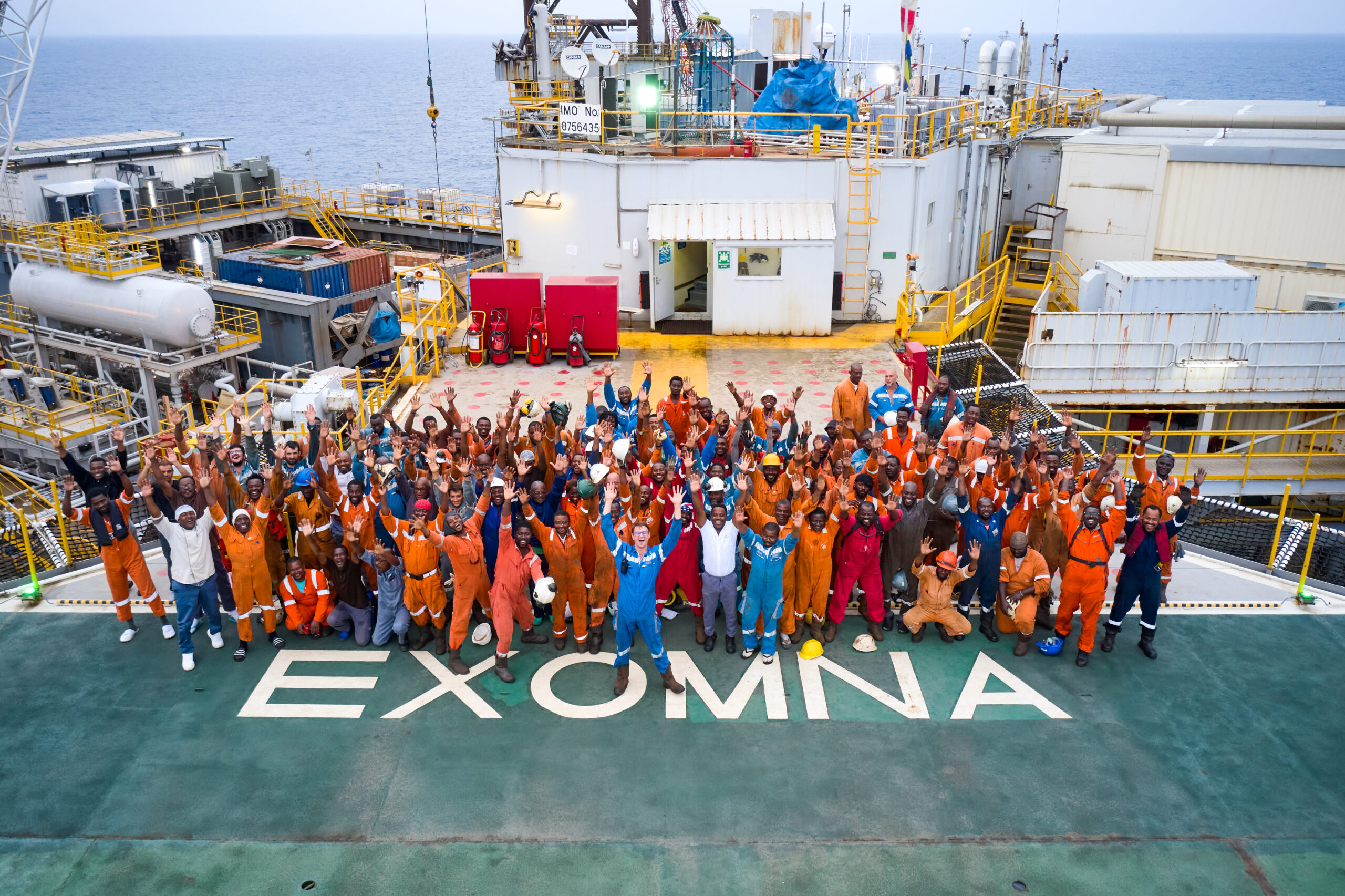 Bunch of people raising hands on cargo in Gabon 