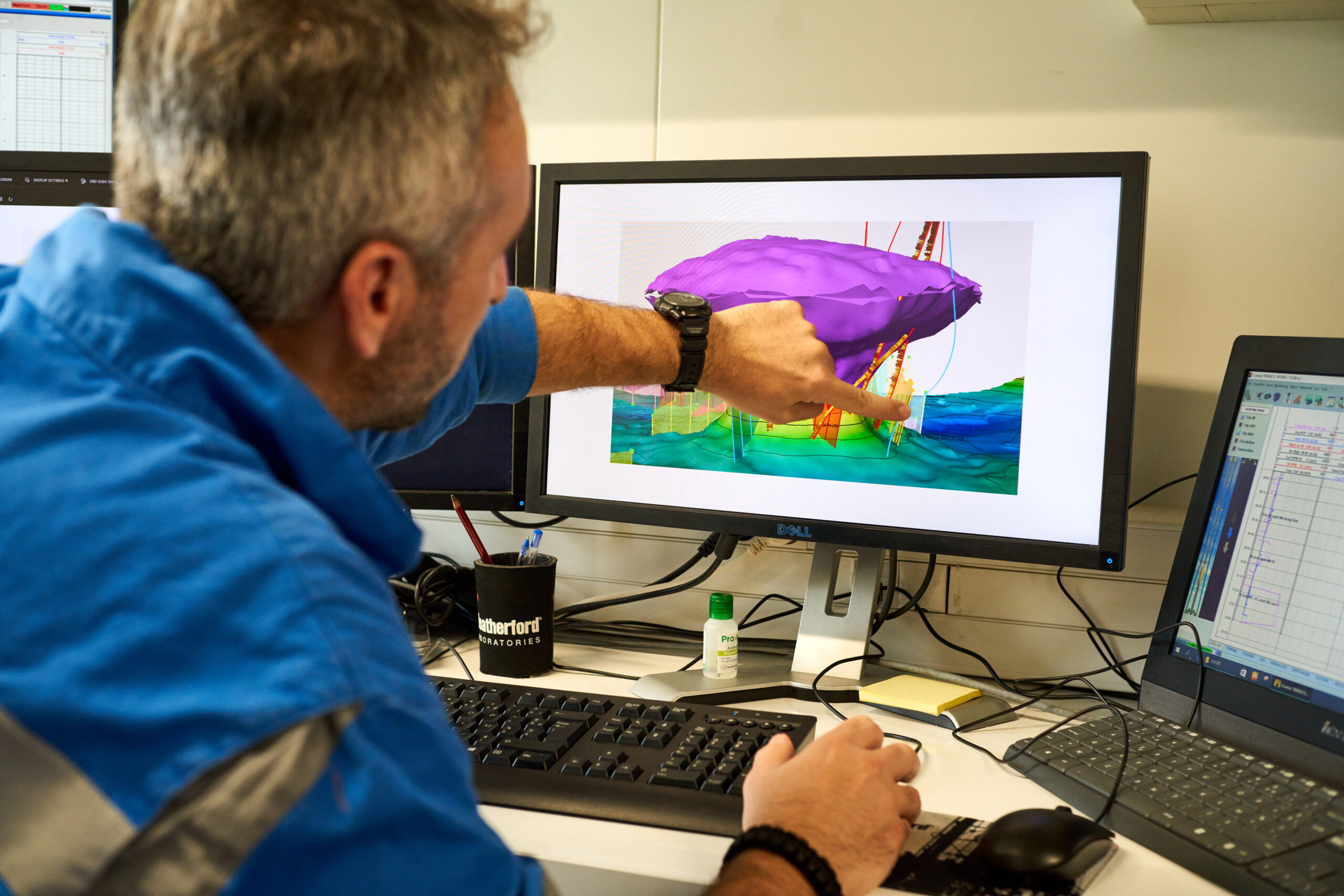 Man showing something on the computer in Gabon