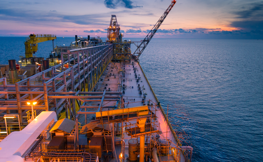 Close up boat navigating in the middle of the sea during sunset offshore Vietnam 