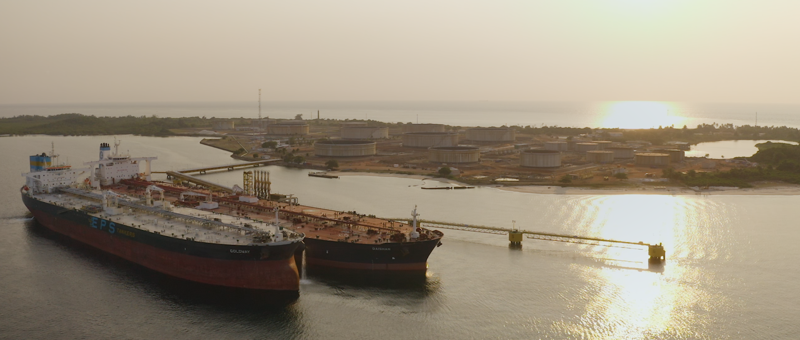 Two cargos at sunset at Cap Lopez in Gabon